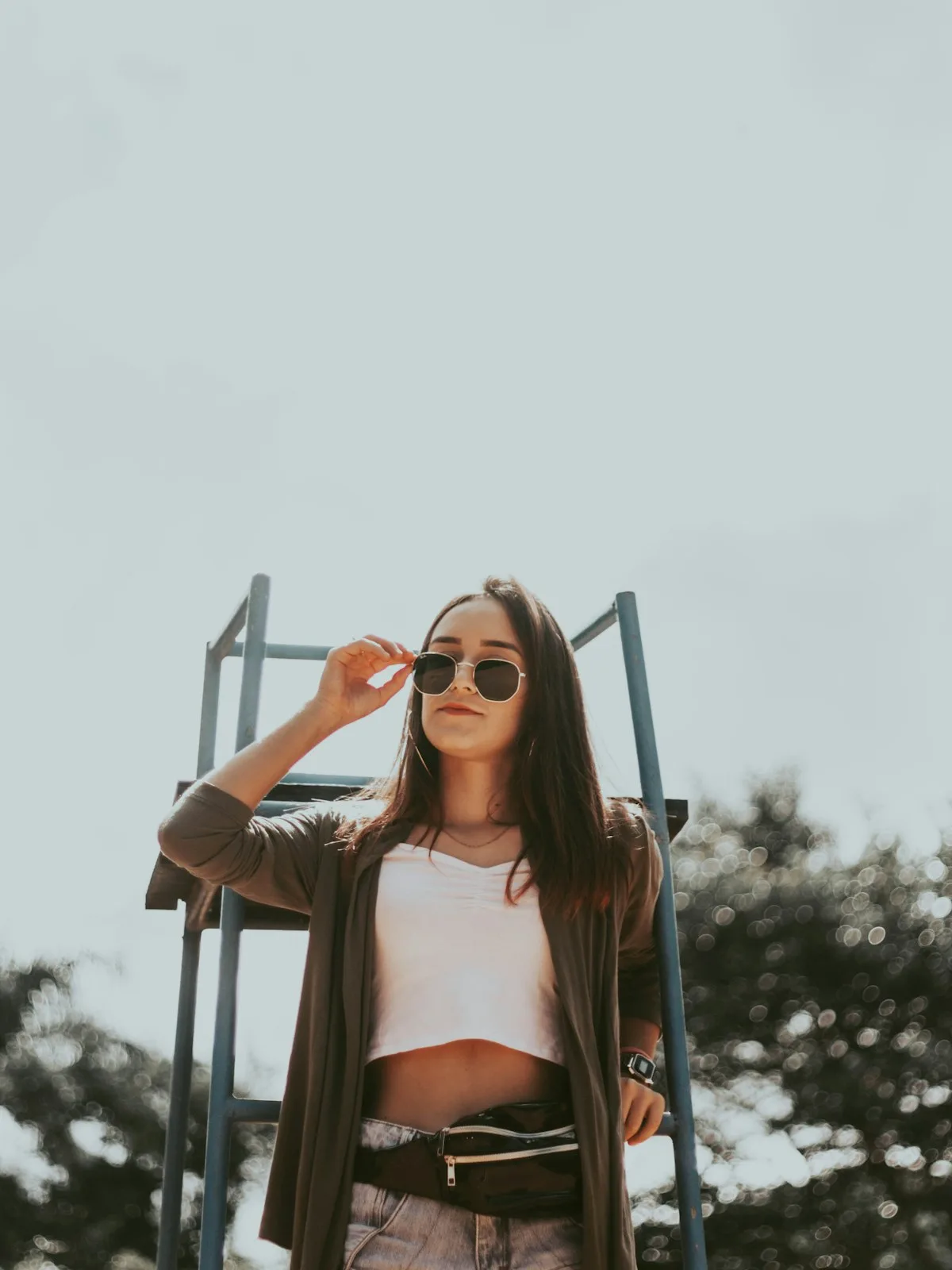 Woman framed low against open sky